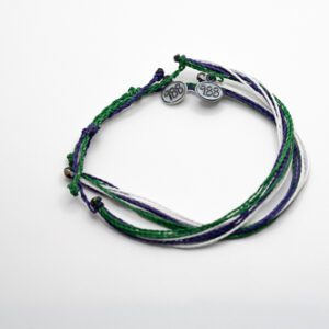 A bracelet with three different colors of string.