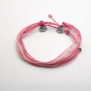 A pink and white bracelet with two silver charms.